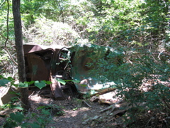 A broken and destroyed automobile
