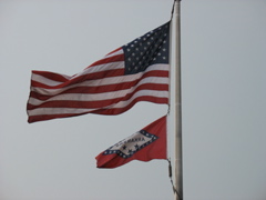 US Flag above that of Arkansas
