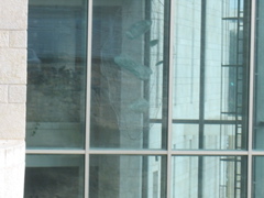 A hanging sculpture inside a building far away