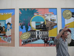 Our guide stands in front of the three panels of Zionism