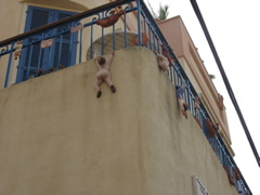 Fake men fall out of a building
