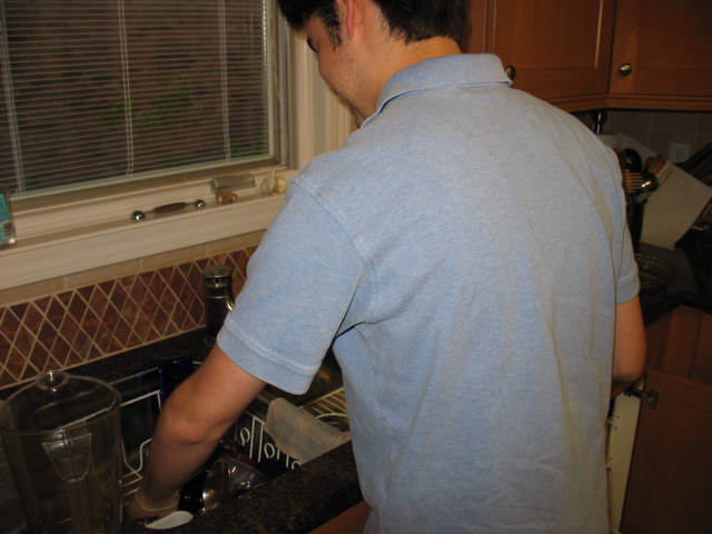 Daniel prepares to clean the sink