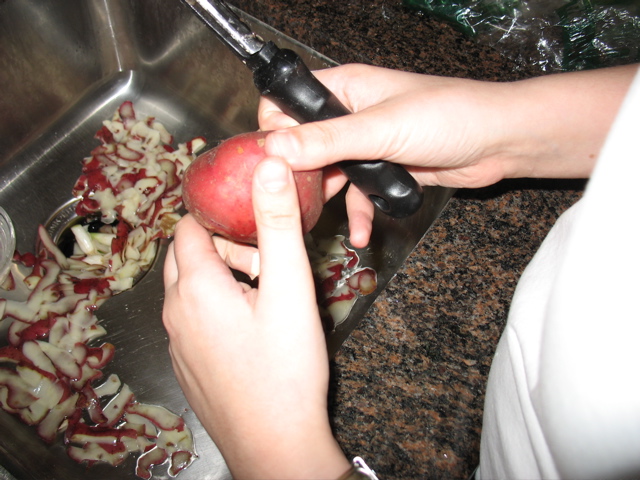 Shosh peels a potato