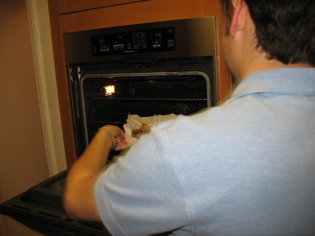 Daniel attacks the oven with the torte