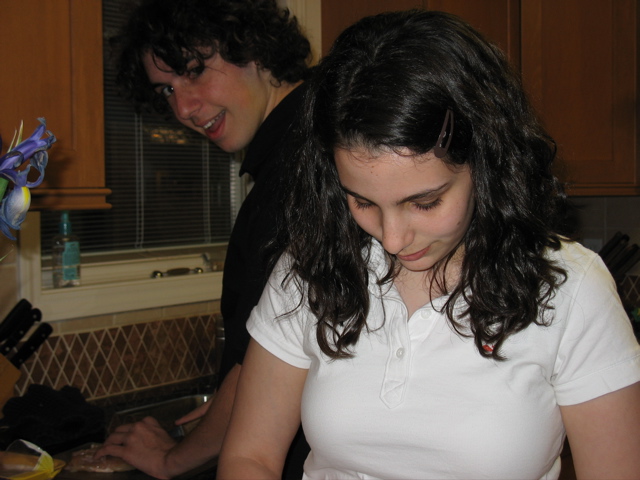 Shosh (cutting vegetables) & Nathan (cutting chicken)