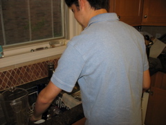 Daniel prepares to clean the sink
