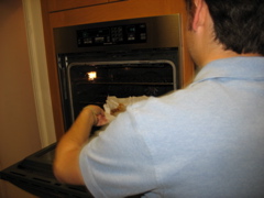 Daniel attacks the oven with the torte