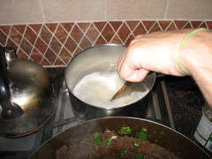 Daniel stirs the saffron rice