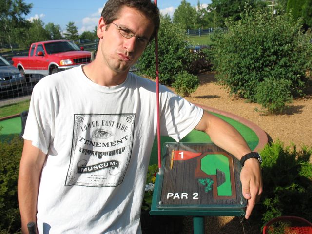 Matt poses with the Settler's Mill hole 1 sign