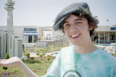 Nathan holds a large building