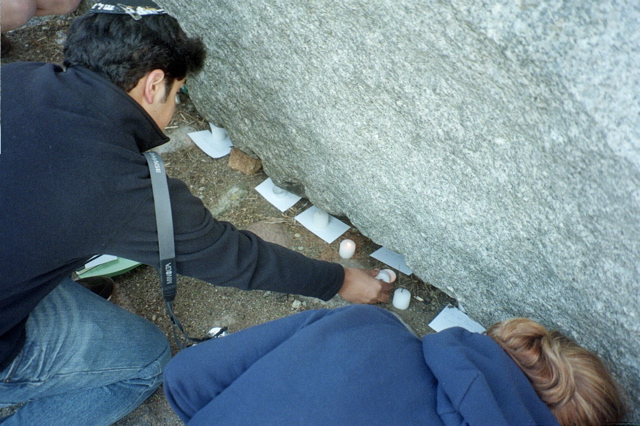 Justin Lighting a candle at the Treblinka Monument