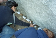 Justin Lighting a candle at the Treblinka Monument