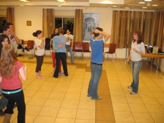 Joey talks to Shoshana [the dance teacher], while others scatter
