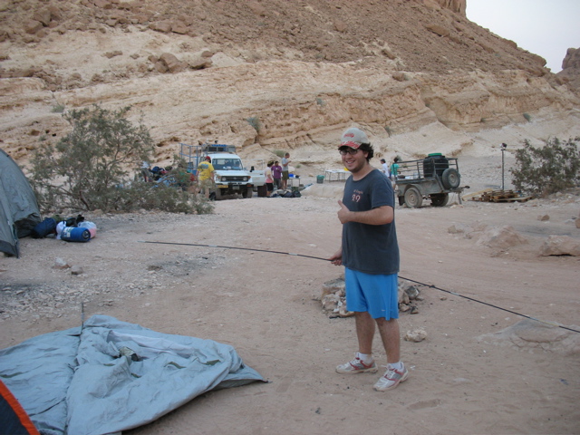 Phil sets up a tent... "And my mom said I couldn't last through a summer of camp. Oh wait."