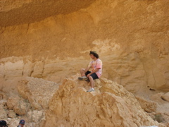 Josh sits perched atop a boulder