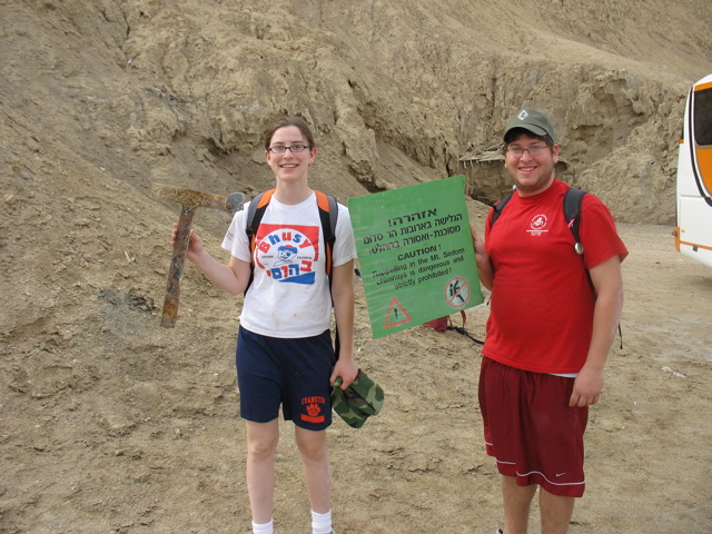 Kobi and Abi with the dilapidated sign