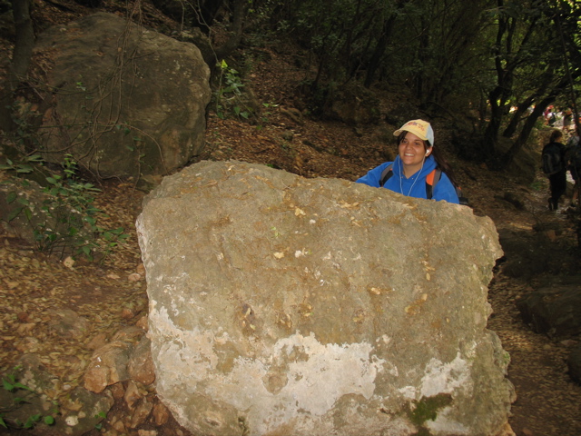 Julia hides behind a rock