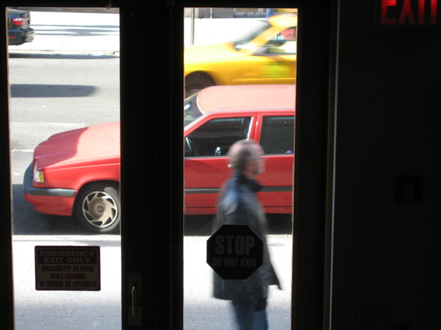 A man with glasses; a cab