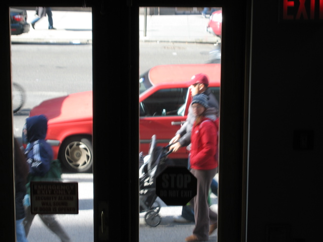 Two women, one with a hoodie, and a couple with a stroller