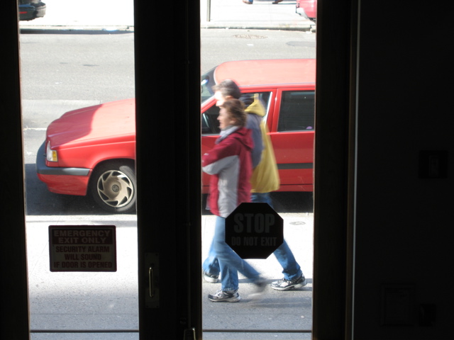 A man and a woman, in different hooded jackets
