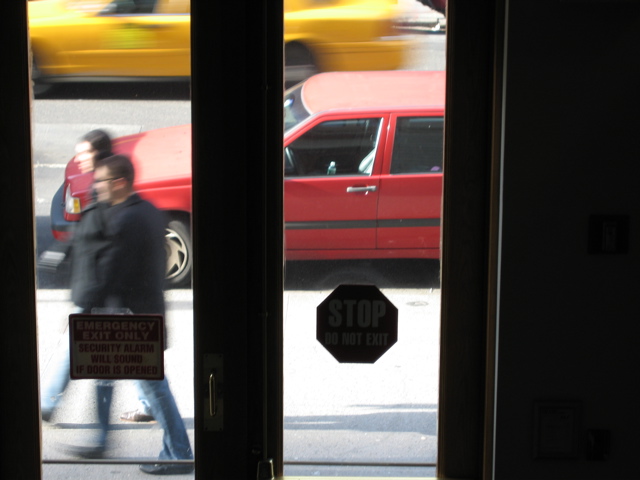 A man with glasses and a woman; a cab