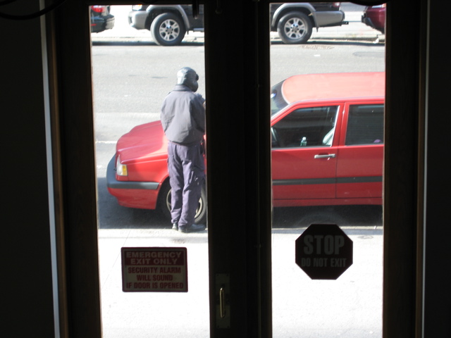 The policeman hovers at the car