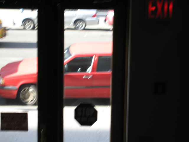 The tiniest tail end of a cab (background)