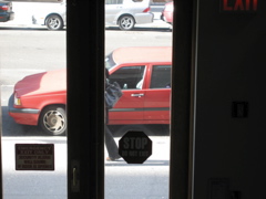 A woman with a large purse (visible purse and leg)