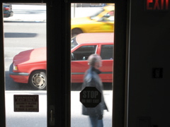 A man with glasses; a cab
