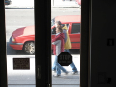 A man and a woman, in different hooded jackets