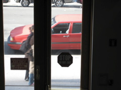 A woman with a black bag and a woman with red shoes
