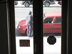 The policeman hovers at the car