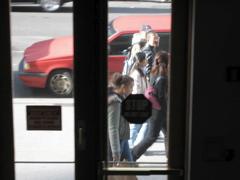 Five people walk by as the SUV leaves