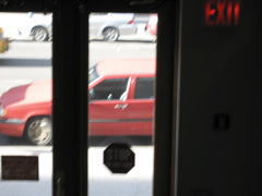 The tiniest tail end of a cab (background)