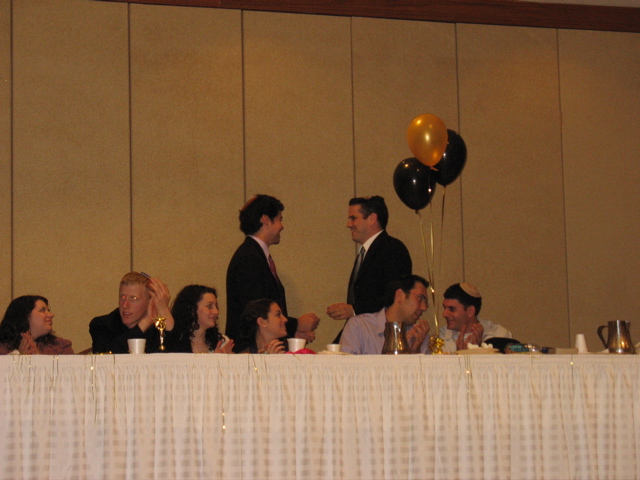 Daniel presents a mezuzah to Benji