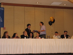 Daniel presents a Seder Plate to Bryan