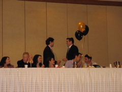Daniel presents a mezuzah to Benji